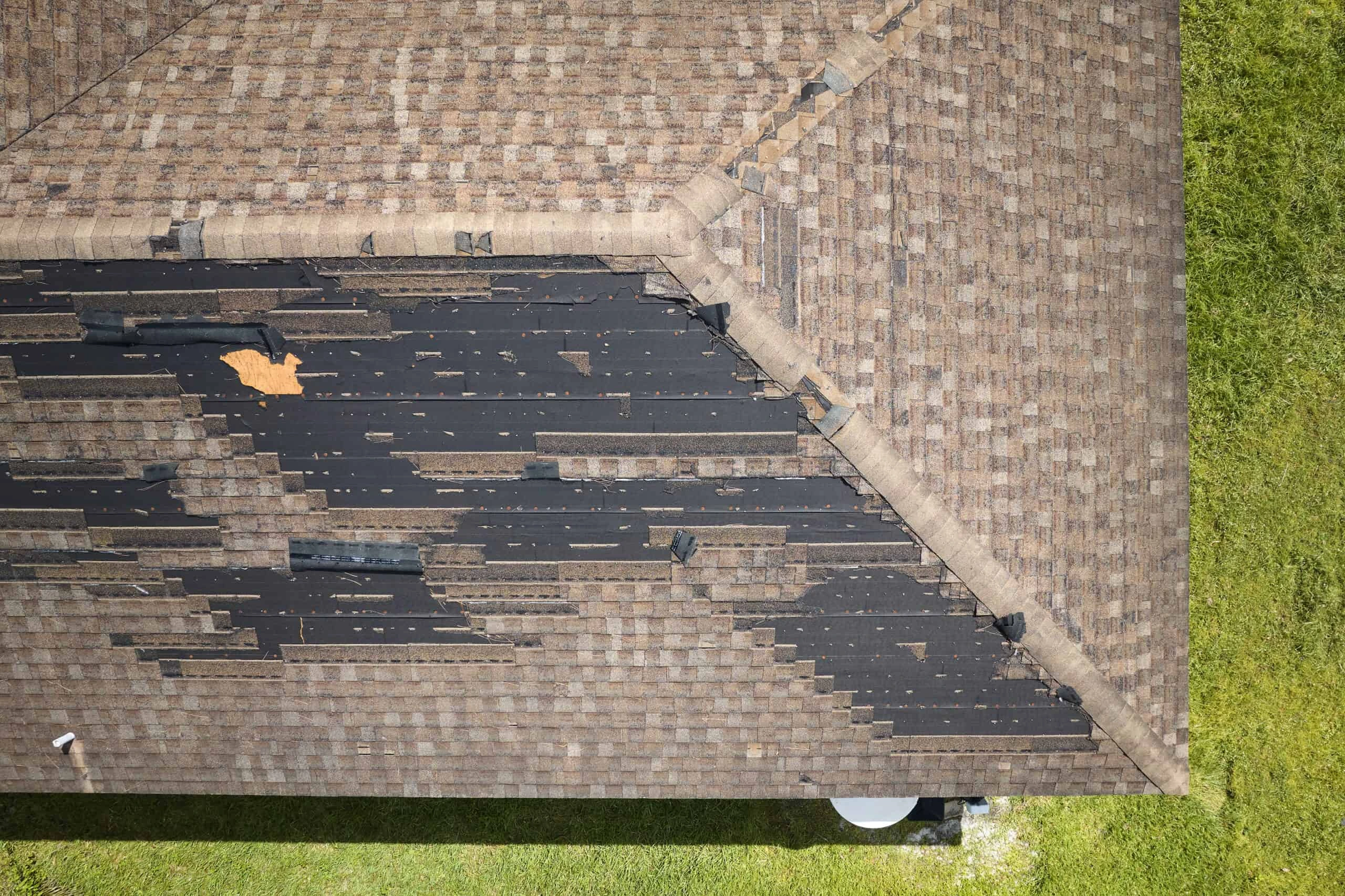 Roof affected by storm damage needing restoration